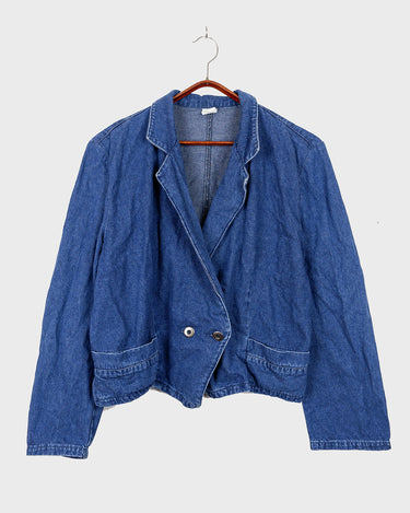 Indulge in your love for denim with this vintage 80s two rows blazer in classic blue. A must-have for any denim enthusiast, this jacket is a timeless addition to your wardrobe.