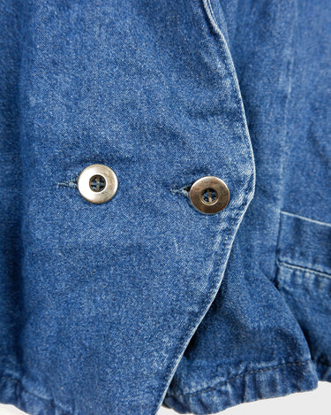 Indulge in your love for denim with this vintage 80s two rows blazer in classic blue. A must-have for any denim enthusiast, this jacket is a timeless addition to your wardrobe.