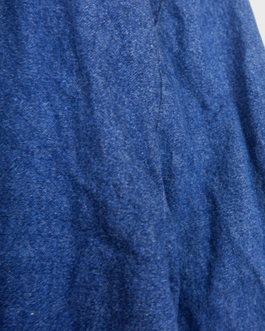 Indulge in your love for denim with this vintage 80s two rows blazer in classic blue. A must-have for any denim enthusiast, this jacket is a timeless addition to your wardrobe.