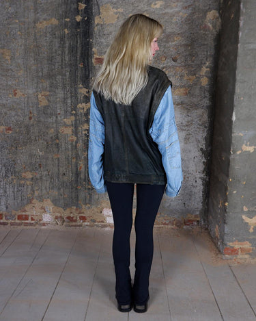 This Vintage 80s denim lamb leather patchwork bomber jacket AND vest is the perfect balance of oldschool and casual charm. Made with high quality materials, it's a statement piece that will add a touch of vintage to any outfit. 