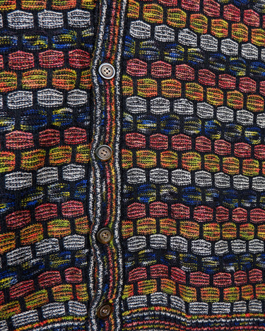 Capture some Missoni-inspired magic with this vintage 80s vest!
