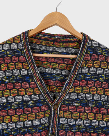 Capture some Missoni-inspired magic with this vintage 80s vest!