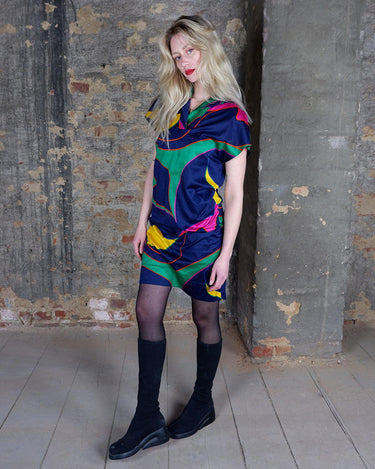 Add a splash of fun to your wardrobe with this colorful, vintage 80s short sleeve dress. The light, transparent fabric adds an eclectic touch, perfect for making a statement and adding a pop of color.