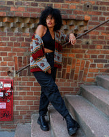 Snuggle up with this vintage 80s boho fleece jacket! With a red and grey color combo, floral pattern, and unbelievably soft feel, you'll be swaddled in comfort with every wear. Cozyness is definitely calling!