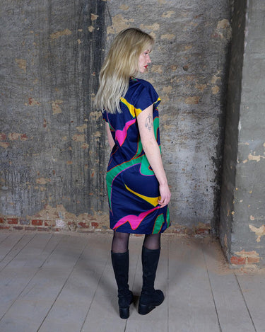 Add a splash of fun to your wardrobe with this colorful, vintage 80s short sleeve dress. The light, transparent fabric adds an eclectic touch, perfect for making a statement and adding a pop of color.