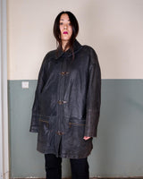 Introducing this Vintage 80s black fireman clasp leather coat, a must-have piece for your collection. Made of buttery soft leather, this coat exudes a cool and edgy vibe.