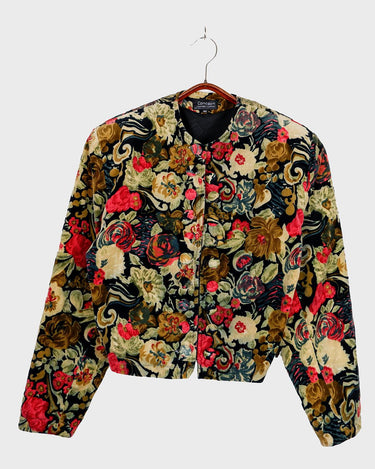 Take your blazer game to the next level with this 90s vintage blazer. Featuring a two-row button closure and playful velvet floral design, this blazer adds a touch of elegance to your outfit.
