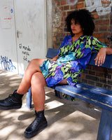 This Vintage 80s 90s blue green dress has it all – a timeless silhouette, a midi length, a button up design and a lightweight fabric!