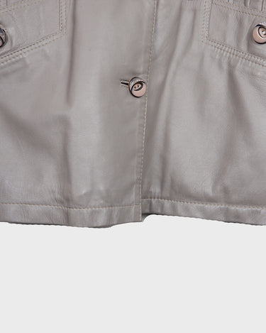 This grey spring coat combines vintage vibes with shoulder pads for a touch of 80s flair.