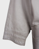 This grey spring coat combines vintage vibes with shoulder pads for a touch of 80s flair.