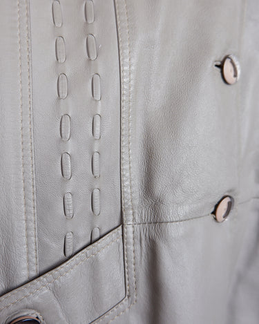 This grey spring coat combines vintage vibes with shoulder pads for a touch of 80s flair.