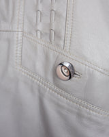 This grey spring coat combines vintage vibes with shoulder pads for a touch of 80s flair.