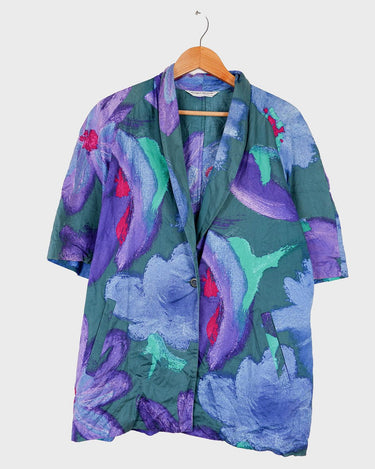Shimmer your way into summer with this colorful Premium Marina Rinaldi shortsleeve jacket! This 80s inspired jacket is so thin, that you'll almost forget you're wearing it! 