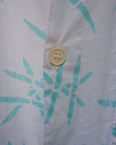 Sun’s out, button up! This Italian vintage white polo shirt brings serious 80s energy with its sharp button-up neckline and eye-catching turquoise pattern. A rare vintage gem that’s equal parts sporty, stylish, and a little cheeky. Wear it loud, wear it proud – this polo’s got main character energy.