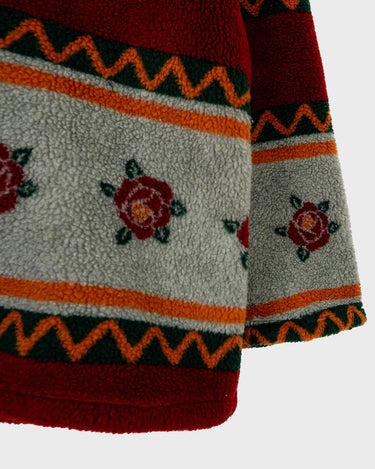 Snuggle up with this vintage 80s boho fleece jacket! With a red and grey color combo, floral pattern, and unbelievably soft feel, you'll be swaddled in comfort with every wear. Cozyness is definitely calling!