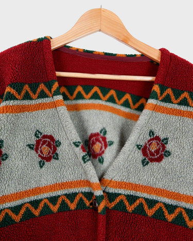 Snuggle up with this vintage 80s boho fleece jacket! With a red and grey color combo, floral pattern, and unbelievably soft feel, you'll be swaddled in comfort with every wear. Cozyness is definitely calling!