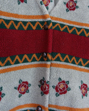 Snuggle up with this vintage 80s boho fleece jacket! With a red and grey color combo, floral pattern, and unbelievably soft feel, you'll be swaddled in comfort with every wear. Cozyness is definitely calling!