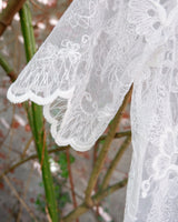 Ditch the boring basics—this handmade lace top is crafted from upcycled curtains. With its romantic vibes, sheer elegance, and intricate embroidery, it’s perfect for layering and embracing your boho side. This one-of-a-kind piece is sustainably made and packed with attitude. Who knew curtains could slay this hard?