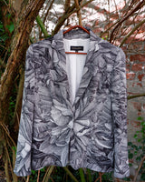 Make a statement with this vintage Escada blazer—bold, tailored, and anything but ordinary. Its detailed monochrome botanical print and iconic Escada cut turn timeless elegance into something effortlessly cool. A rare secondhand gem for lovers of slow fashion and sharp silhouettes, this piece brings instant edge to any outfit. Vintage luxury, with attitude.