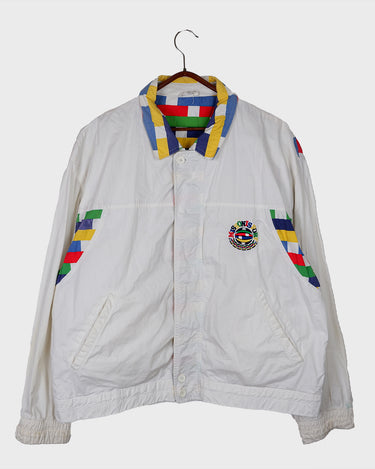 This vintage Missoni Sport windbreaker from the 90s is a standout piece with its bold striped accents and iconic globe logo embroidery. Made in Italy and cut in a comfortable size L, it offers a relaxed fit and lightweight feel – ideal for everyday wear. A rare example of Missoni’s sporty aesthetic, combining timeless design with a splash of color. Effortlessly cool and easy to style.