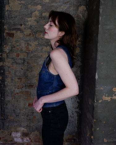 This vintage denim vest is tough, timeless, and ready to layer. It features classic brass snap buttons and four front pockets for that old-school workwear vibe.