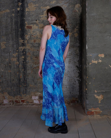 Soft shades of blue and a flowing cut give this 90s maxi dress an easy, fairy-like feel. The asymmetrical hem adds just enough edge to keep it from being too sweet.