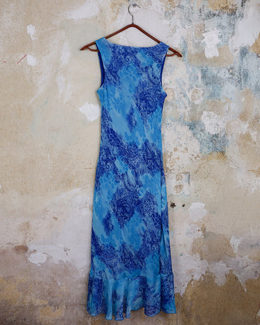 Soft shades of blue and a flowing cut give this 90s maxi dress an easy, fairy-like feel. The asymmetrical hem adds just enough edge to keep it from being too sweet.