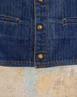 This vintage denim vest is tough, timeless, and ready to layer. It features classic brass snap buttons and four front pockets for that old-school workwear vibe.