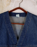 This vintage denim vest is tough, timeless, and ready to layer. It features classic brass snap buttons and four front pockets for that old-school workwear vibe.