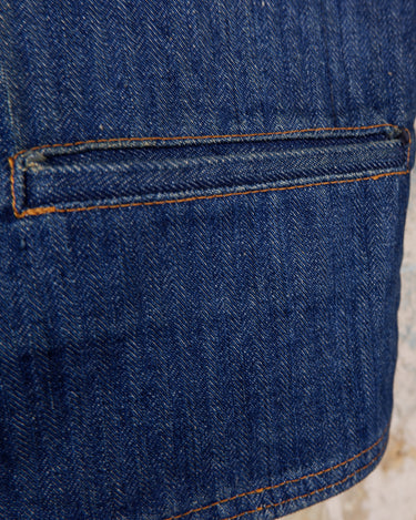 This vintage denim vest is tough, timeless, and ready to layer. It features classic brass snap buttons and four front pockets for that old-school workwear vibe.