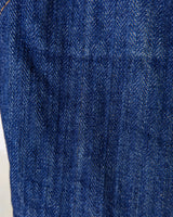 This vintage denim vest is tough, timeless, and ready to layer. It features classic brass snap buttons and four front pockets for that old-school workwear vibe.