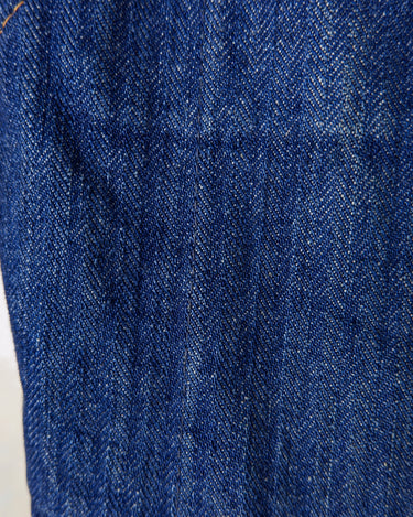 This vintage denim vest is tough, timeless, and ready to layer. It features classic brass snap buttons and four front pockets for that old-school workwear vibe.
