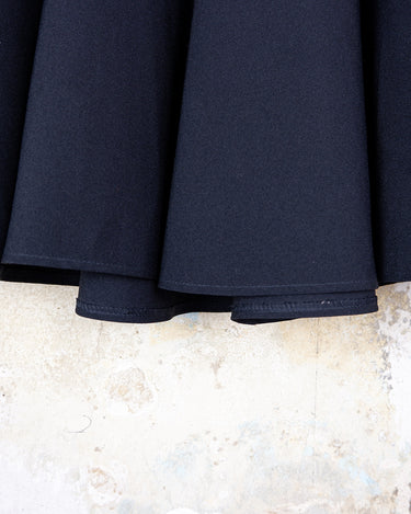 This vintage 90s mini skirt with bold gold ring details is a true statement piece with attitude. Vintage, but made for now.