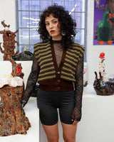 This vintage piece is sure to be a hit! Get out of the ordinary and jump into the ‘90s with this vintage brown vest - fun green stripes make it a true stand-out. It's an old-school classic with an updated twist! Please keep in mind, that this vest has some stains and flaws (last photos)