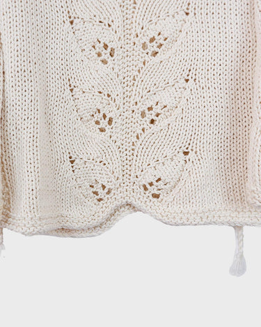 Say goodbye to basic sweaters! This handmade white sweater with dramatic flared sleeves is sure to make a statement. Who needs plain when you've got flair?!