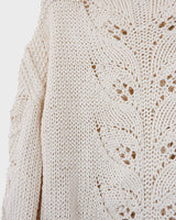 Say goodbye to basic sweaters! This handmade white sweater with dramatic flared sleeves is sure to make a statement. Who needs plain when you've got flair?!
