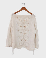 Say goodbye to basic sweaters! This handmade white sweater with dramatic flared sleeves is sure to make a statement. Who needs plain when you've got flair?!