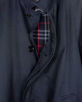 This Burberry dark navy blue coat (thin) is a classic look that never goes out of style! Its timeless design and high-quality fabric make it as fashionable as it is comfortable. Wrap up in luxury today! The color shades of this coat is dark blue (depends on the lightning). Please keep in mind, that this luxury coat has some flaws - last photos)