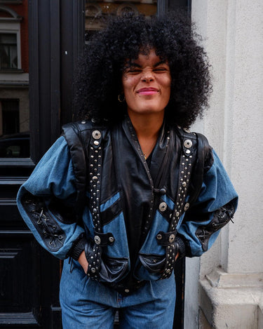 This vintage 80s masterpiece is a patch-perfect combination of denim and leather! Made with premium materials to give your look a unique edge. Adjustable sleeves with a zipper can easily transform it into a vest. Go ahead, have fun with your style!