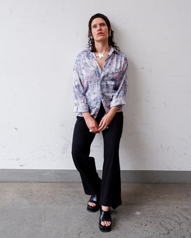 This vintage 1980s Tipo's shirt features a soft pastel floral pattern in shades of pink, blue, and grey, creating a dreamy, watercolor-like aesthetic. With its relaxed fit, long sleeves, and lightweight fabric, it’s perfect for your everyday look.