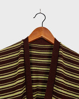 This vintage piece is sure to be a hit! Get out of the ordinary and jump into the ‘90s with this vintage brown vest - fun green stripes make it a true stand-out. It's an old-school classic with an updated twist! Please keep in mind, that this vest has some stains and flaws (last photos)