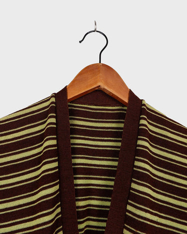 This vintage piece is sure to be a hit! Get out of the ordinary and jump into the ‘90s with this vintage brown vest - fun green stripes make it a true stand-out. It's an old-school classic with an updated twist! Please keep in mind, that this vest has some stains and flaws (last photos)