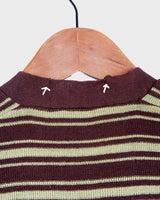 This vintage piece is sure to be a hit! Get out of the ordinary and jump into the ‘90s with this vintage brown vest - fun green stripes make it a true stand-out. It's an old-school classic with an updated twist! Please keep in mind, that this vest has some stains and flaws (last photos)