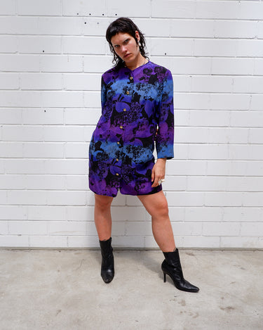 Vintage 80s, floral and fearless. Wear it open as a coat or buttoned up as a dress – either way, it’s a look. Statement gold buttons, bold print, and zero effort. For those who don’t just wear vintage – they own it.