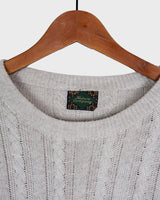 Tired of the same-old, boring sweaters? Look no further than this vintage 80s sweater! It's the perfect mix of classic and oldscool with its dirty white beige hue and classic cable knit pattern. Brown geometric details give it a subtle but unique edge. The thin knit makes it perfect for all-year wear!