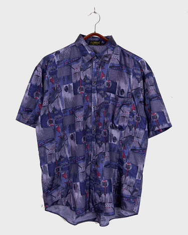 Bold, breezy, and silky smooth - this rare 90s short-sleeve gem by T. Corner is made from real Thai silk, brought to you by one of Thailand’s most renowned silk producers. The glossy fabric pops with a crazy pattern in electric purples and blues that’s impossible to ignore. Wear it loud, wear it proud!