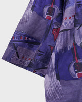Bold, breezy, and silky smooth - this rare 90s short-sleeve gem by T. Corner is made from real Thai silk, brought to you by one of Thailand’s most renowned silk producers. The glossy fabric pops with a crazy pattern in electric purples and blues that’s impossible to ignore. Wear it loud, wear it proud!