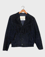 Classy with a hint of wild! This vintage 80s black fringe leather jacket features edgy shoulder pads and flowing fringes. Make a style statement fit for any sassy bohemian lover! 
