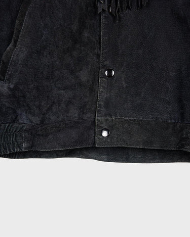 Classy with a hint of wild! This vintage 80s black fringe leather jacket features edgy shoulder pads and flowing fringes. Make a style statement fit for any sassy bohemian lover! 