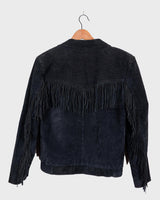 Classy with a hint of wild! This vintage 80s black fringe leather jacket features edgy shoulder pads and flowing fringes. Make a style statement fit for any sassy bohemian lover! 